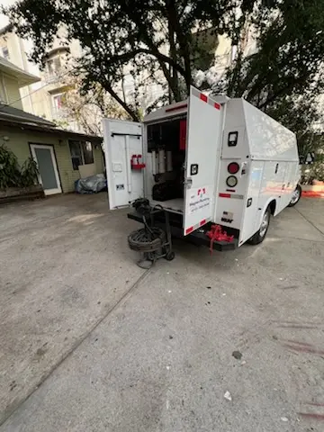 Magnet Plumbing service vehicle on-site for Grease Trap Cleaning in Tyndall Park